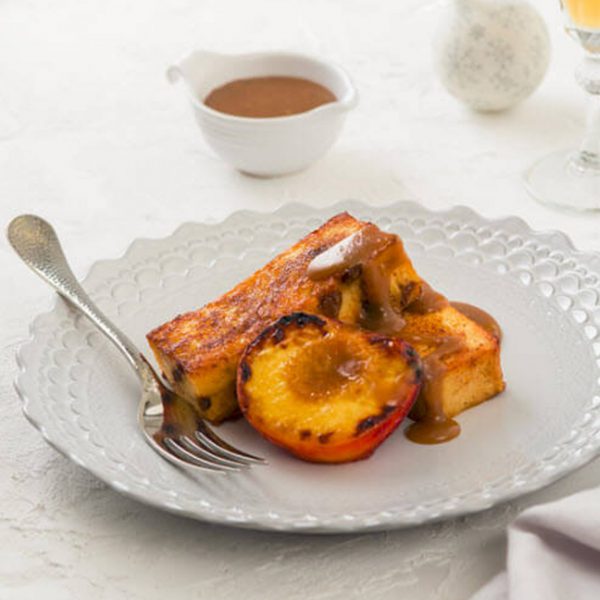 Panettone French Toast with Grilled Peaches and Caramel Sauce